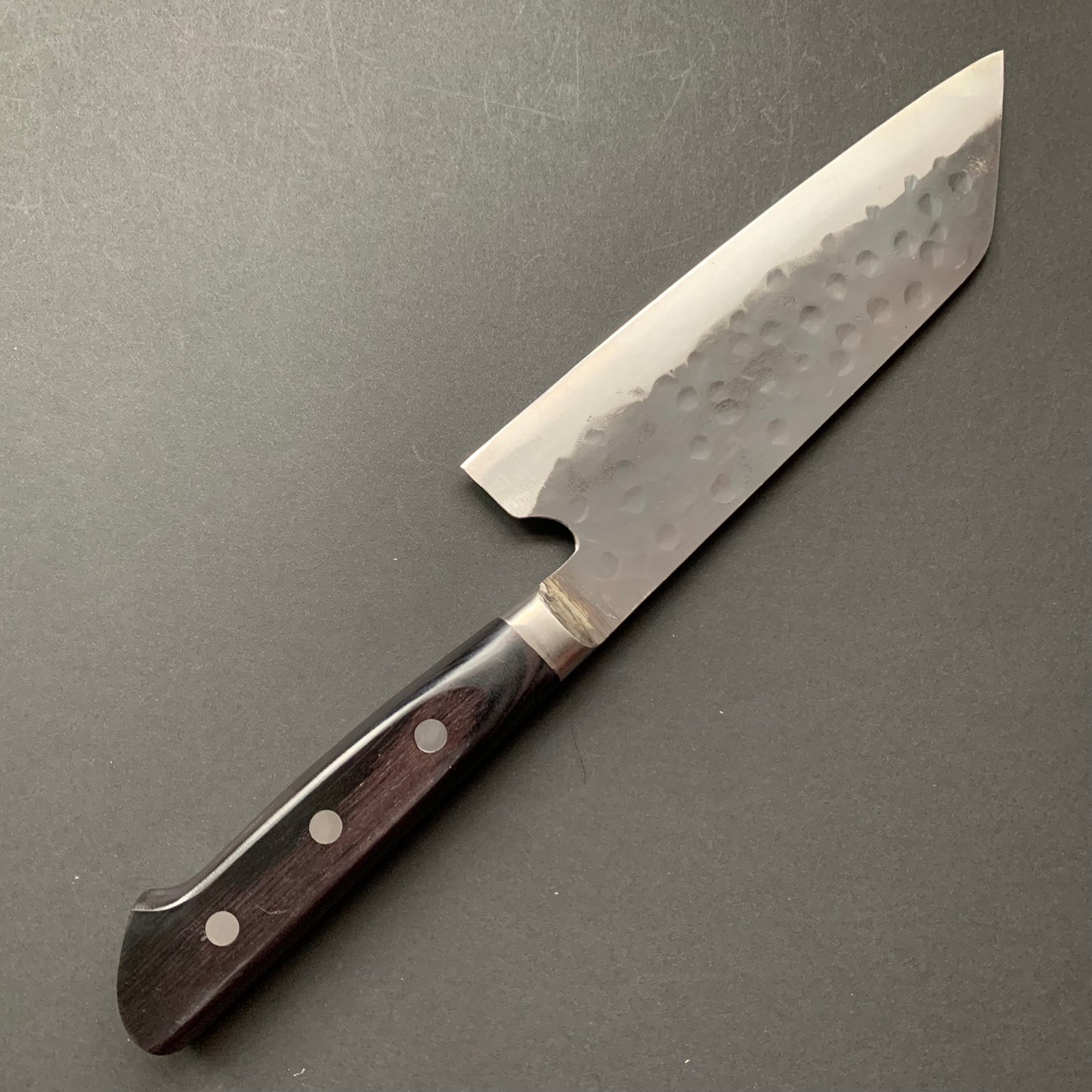 Santoku knife, Aogami super with stainless steel cladding, Tsuchime Kurouchi finish, Denka range, Western handle - Fujiwara