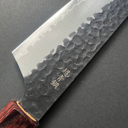 Kengata Santoku knife, Aogami Super carbon steel with stainless steel cladding, Kurouchi Tsuchime finish, Wa handle - Sakai Takayuki